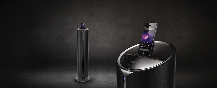Philips Fidelio Soundtower mit DualDock DTM5096 Der Philips Fidelio Soundtower mit DualDock DTM5096 ist ein 3.1-Lautsprechersystem mit integriertem Subwoofer und 200 Watt Gesamtausgangsleistung. Durch Nutzung des digitalen Audioausganges und die Anwendung digitaler Verarbeitungstechnologie entsteht ein unübertroffen klarer und harmonischer Sound. Die integrierte LivingSound-Technologie erweitert die ideale Hörposition im Raum, den sogenannten „Sweet Spot“. Dabei garantiert eine Kombination von verschiedenen Klangprozessen, dass Fülle und Details im Raumklangbereich erhalten bleiben, die bei einer kompakten Stereoanlage oft verloren gehen. Der DTM5096 bietet Anschlussmöglichkeiten für diverse Abspielgeräte: von USB Direct über DualDock mit Lightning- und 30-Pin-Connector bis hin zu Bluetooth-Technologie mit aptX. Außerdem sind ein CD-Laufwerk und ein integriertes Radio vorhanden. Das Tower Design passt perfekt zu einer modernen Wohneinrichtung.